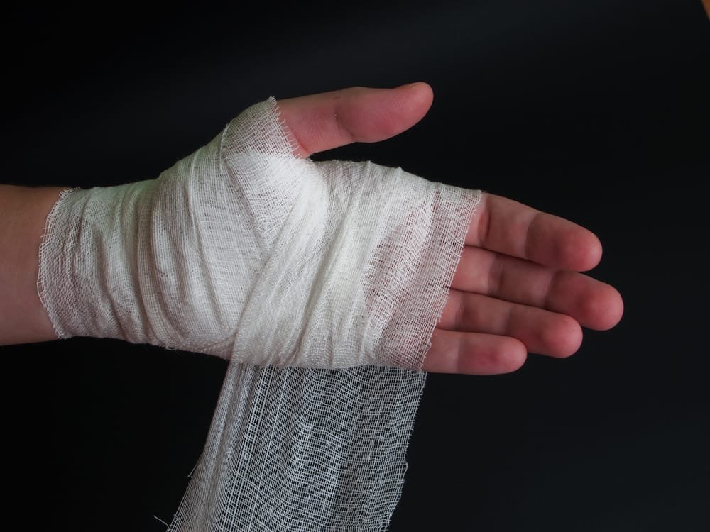 A hand with a bandage wrapped around it.